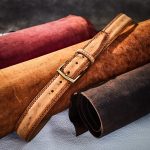 Weld belts with central grooving and ornamental stitchings